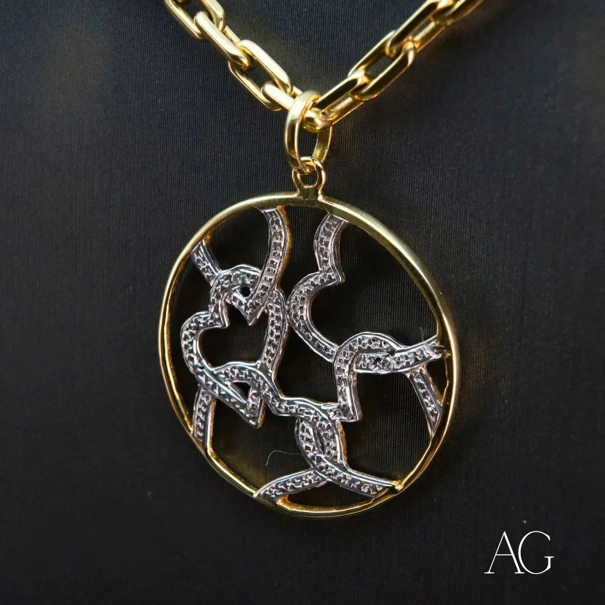18k solid gold hearts pendant with two-tone diamond-studded abstract design