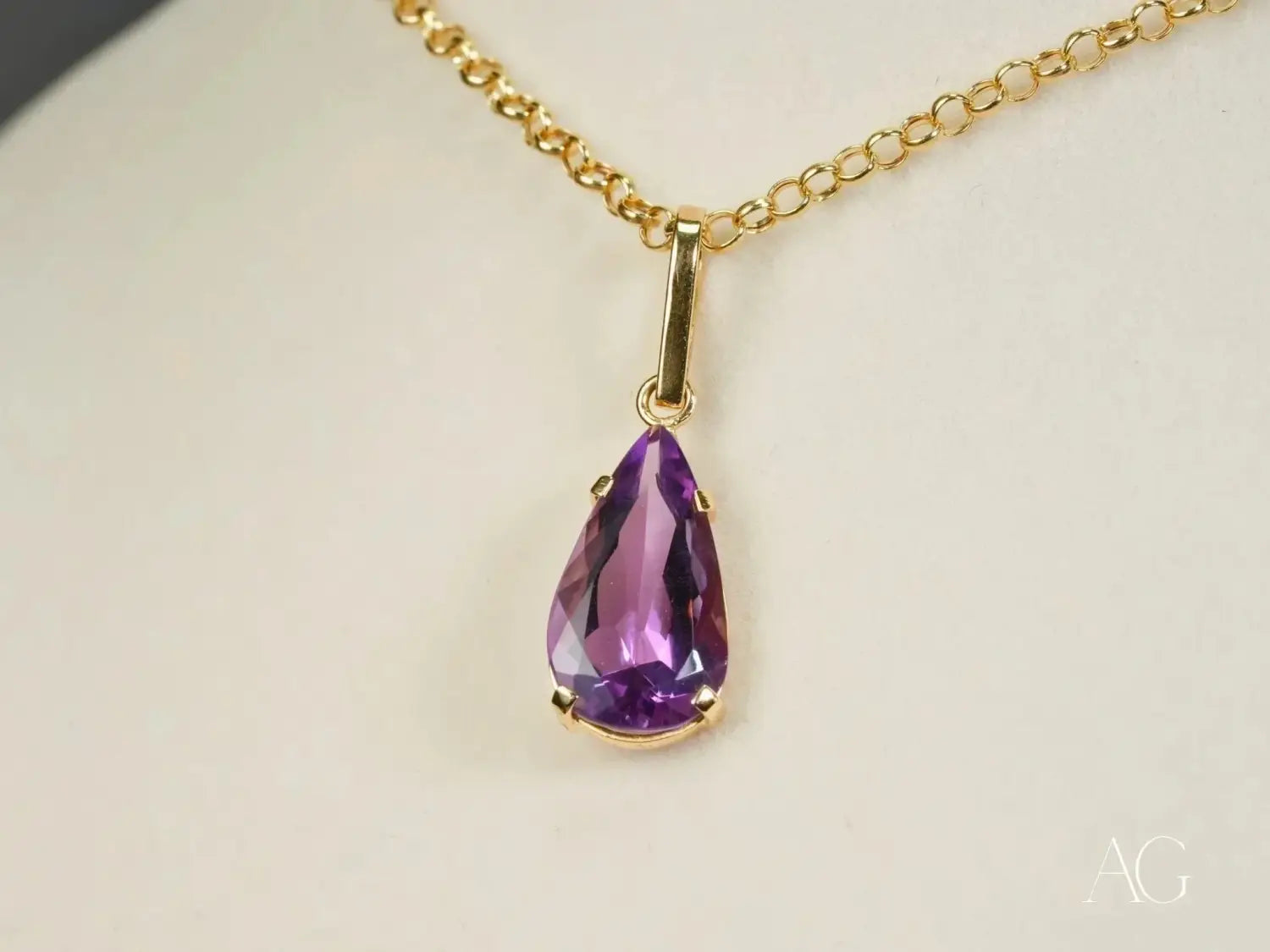 Teardrop amethyst pendant in 14k gold on chain, timeless royal jewels.