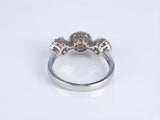 Three-stone diamond cluster ring, underside view showing gallery and openwork cluster settings