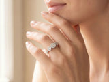Three-stone diamond cluster ring with triple diamond clusters and diamond shoulders, close-up detail