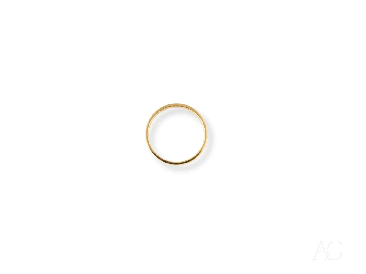 Timeless 18k yellow gold wedding band in polished art gold jewelry