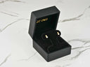 Black velvet box with 18K gold freshwater pearl stud earrings