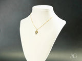 Timeless Charm 18k solid gold pendant with faceted gemstone