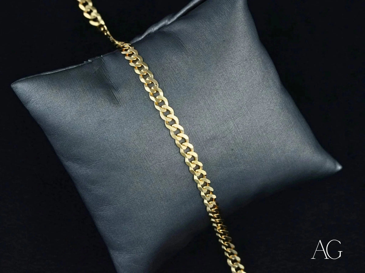 Shiny 18k solid gold Cuban link bracelet from Art Gold Jewelry