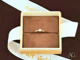 18k yellow gold solitaire ring with round cubic zirconia, overhead view