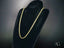Solid 14k gold rope chain necklace with lobster lock on black display