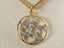 Gold and diamond round pendant on delicate chain from Timeless Love Pendant in 18k solid gold