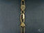 Gold chain with lobster clasp marked 18K 750, showcasing classic box link art gold jewelry
