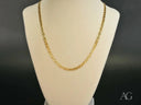 Polished 18K gold anchor chain necklace on mannequin, timeless strength design