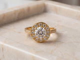 Top-down view of Star halo ring with round diamond center and pavé band