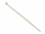 The bracelet opened and laid in an arc seen from above, the pave-set spherical clasp at one end and the plain gold loop it fastens to at the other