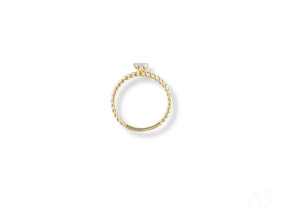 Twist of Brilliance engagement ring with twisted band and diamond focal point