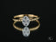 Gold twisted band ring with diamond focal point, part of Twist of Brilliance Engagement Ring collection
