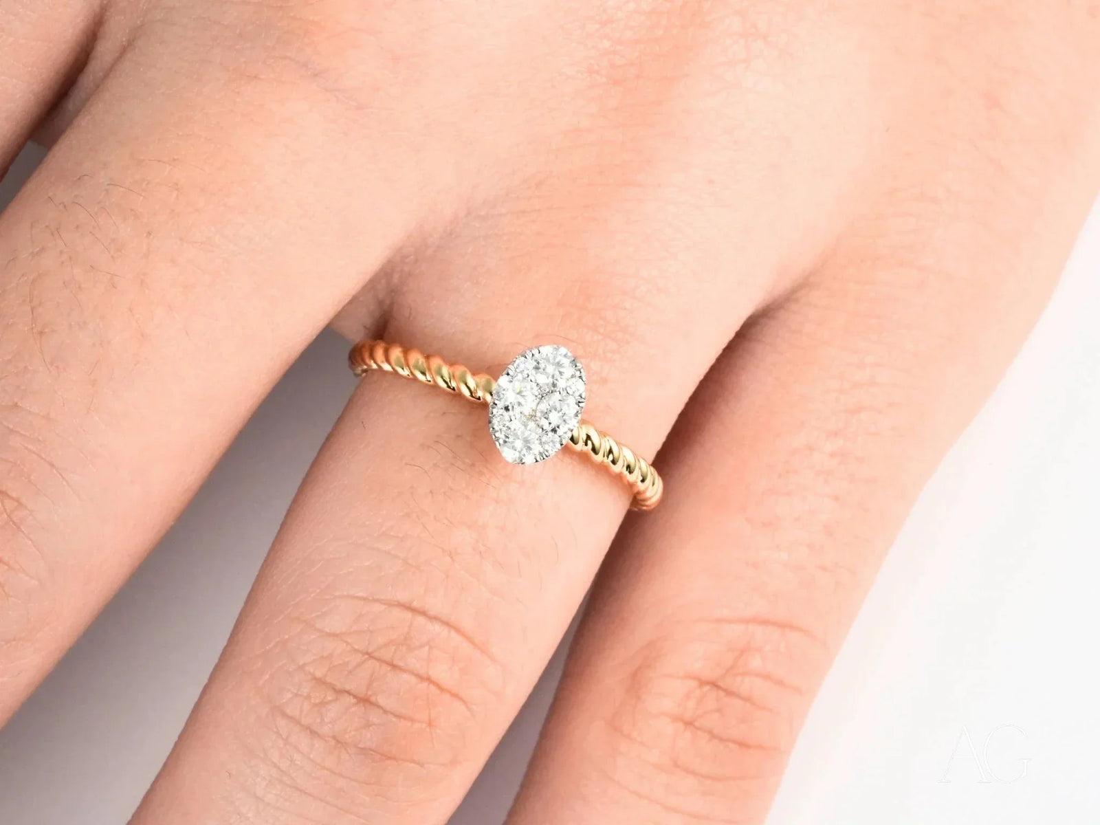 Twist of Brilliance Engagement Ring with twisted band and oval diamond focal point