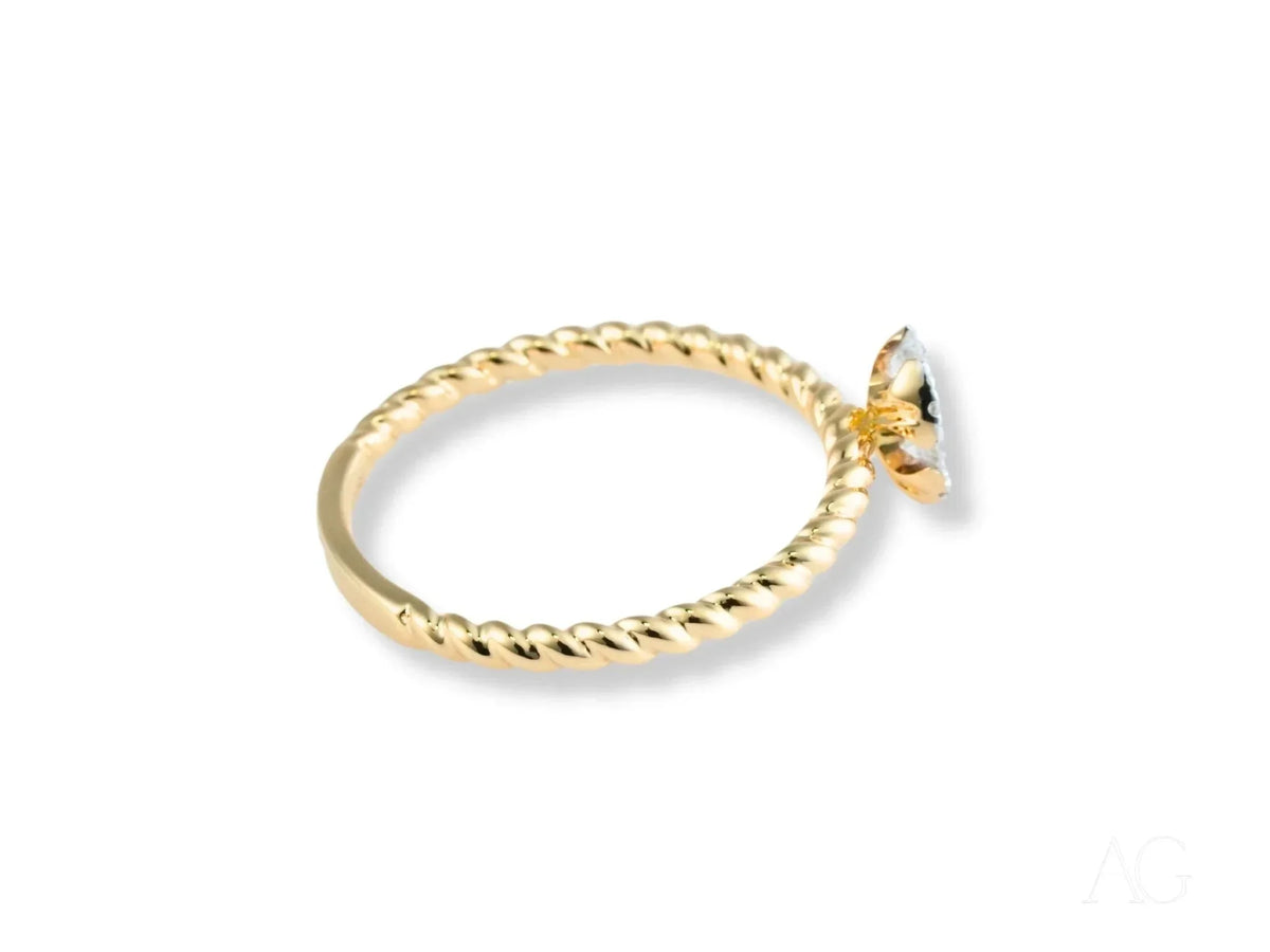 Twist of Brilliance Engagement Ring with twisted band and pear-shaped diamond focal point