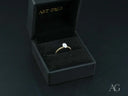 Twist of Brilliance engagement ring with twisted band and diamond focal point