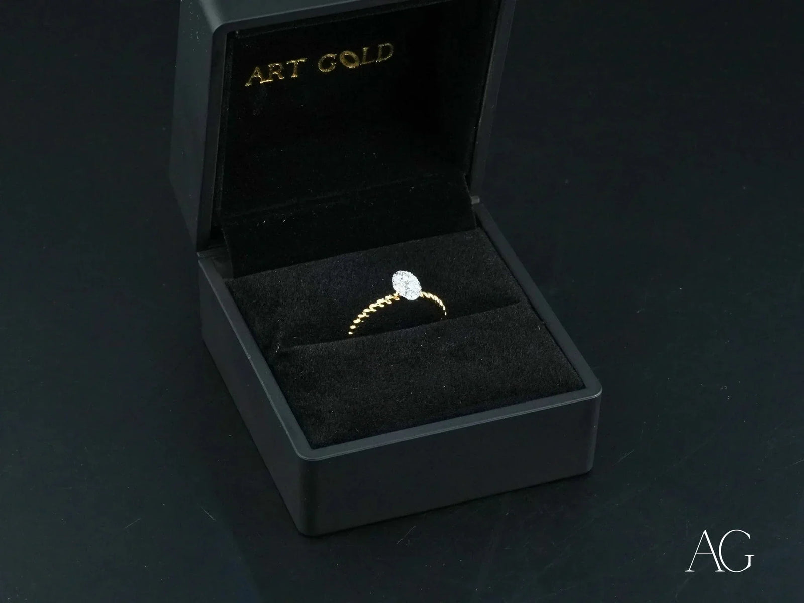 Twist of Brilliance engagement ring with twisted band and diamond focal point