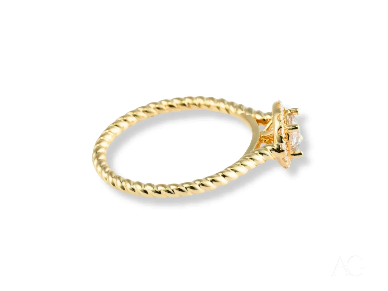 Twist of Grace engagement ring with twisted band in 18k gold and diamond halo