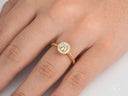 Twist of Grace 18k gold engagement ring with sparkling diamond cluster
