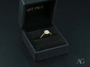 Twist of Grace engagement ring with sparkling diamond in 18k gold twisted band