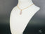 Violet Essence Amethyst Pendant in art gold jewelry with marquise-shaped light pink stone