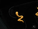 Gold-colored snake-shaped wavy earrings in certified 18k solid art gold jewelry