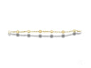 Women’s solid 18k gold bracelet with spring ring clasp and gold beads