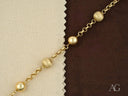 Women’s solid 18k gold bracelet with spring ring clasp and spherical beads