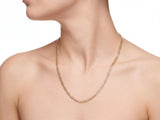 14K yellow gold Cuban chain worn on a model, the chain resting on the upper sternum