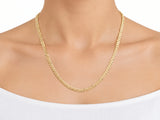 14K yellow gold Cuban chain worn at the neck, resting on the upper chest